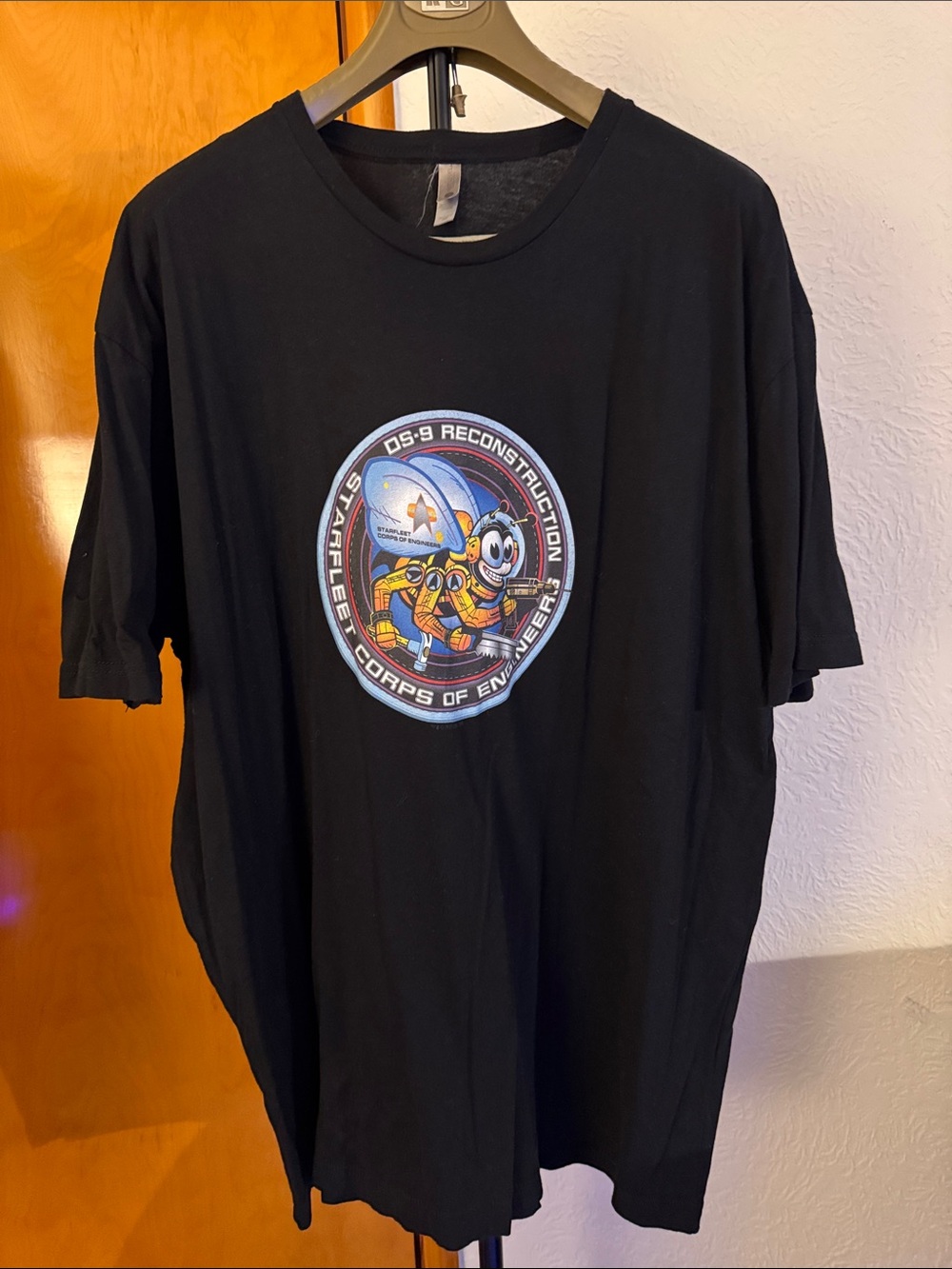 Next Level Apparel Black Short Sleeve Tee with Colorful Space Engineer Patch